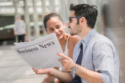 Preview: Businesspeople Reading Newspaper .Happy Couple Reading Newspaper Concept.