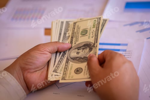 Preview: Two Female Accountants Counting On Calculator Income For Tax Form Completion Hands Closeup
