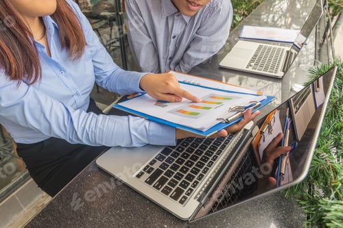 Preview: Woman Showing Her Workmate The Result Of Sales Report