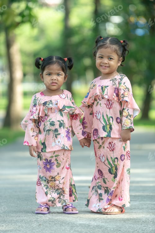 Preview: Malay Muslim Little Girls In Their Beautiful Eid Dress. Outdoor Portrait