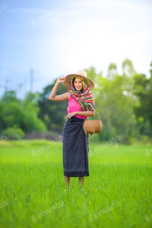 Preview: Asian Farmers In Green Rice Fields.