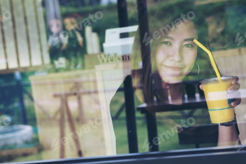 Preview: Closeup Portrait Image Of Beautiful Asian Woman With Glass Reflection In Modern Cafe Abstract