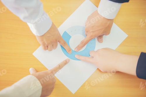 Preview: Business People Point To Business Documents Brainstorming During Meetings