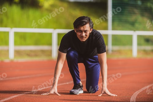 Preview: Chinese Asian Sport Guy At A Stadium Track, On The Starting Line