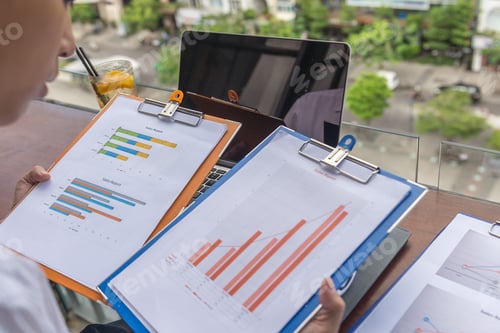 Preview: Businessman Review And Compare Data Of Report