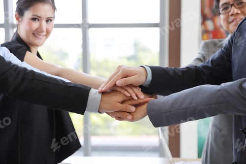 Preview: Close Up Of Multiethnic Business People Stacking Hands Together Meaning Of Teamwork Concept