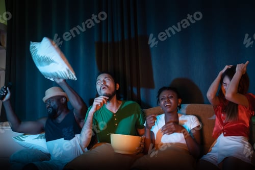 Preview: Group Of Friend Sitting On Sofa For Watching Television Together, Feeling Upset For Lose Game