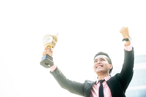 Preview: Businessman Wins A Trophy. Top Salesperson Concept