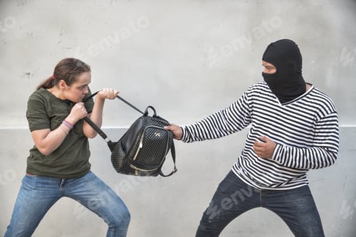 Preview: Thief Stealing Bag From Walking Woman On Street And Woman Try To Fight Back (Theft Concept)
