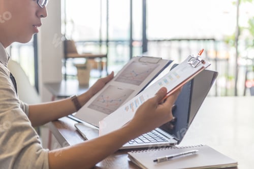 Preview: Side View Of Businessman Reading Financial Documents