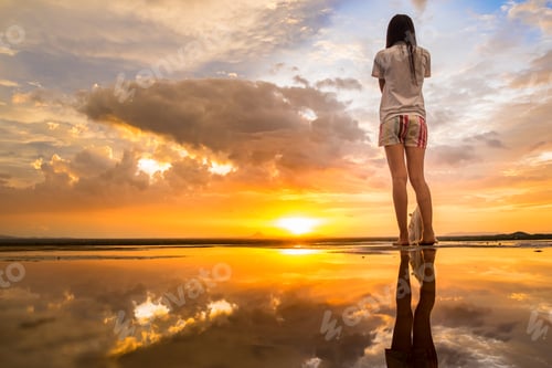 Preview: Young Asian Woman And Cat At Sunset