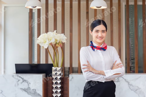 Preview: Young Woman Receptionist Standing With Arms Crossed And Smiling To Camera. Portrait Of Female
