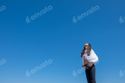 Preview: Happy Woman With Tanned Slim Body Breathing Fresh Air Raising Her Arms Up, Enjoying A Sunny Summer
