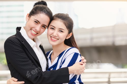 Preview: Portrait Of Happy Asian Women Hugging Each Friend Outdoor City Background