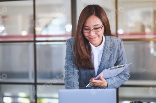 Preview: Closeup Image Of An Asian Business Woman Using Laptop Computer While Working In Office
