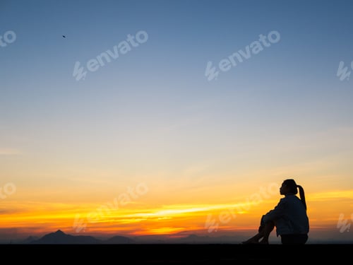 Preview: Silhouette Of Free Woman Enjoying Freedom Feeling Happy At Sunset. Serene Relaxing Woman In Pure