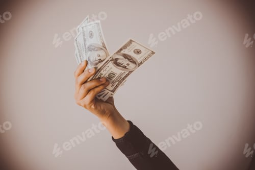 Preview: Businesswoman Displaying A Spread Of Cash Over A Green Vintage Background