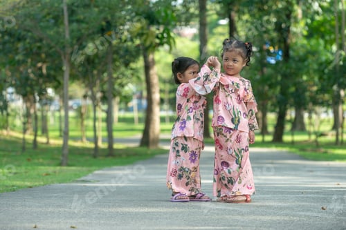 Preview: Malay Muslim Little Girls In Their Beautiful Eid Dress. Outdoor Portrait