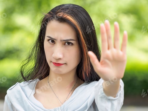 Preview: Beautiful Asian Woman Doing Stop Gesture.