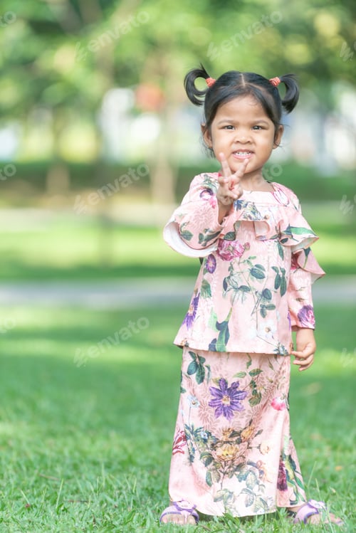 Preview: Cute Malaysian Kid In Eid Costume. Outdoor Portrait.
