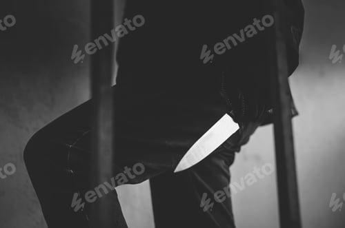 Preview: Black And White Photo Of Bandit Wearing A Mask Walking On Stairs With A Knife For The Loot