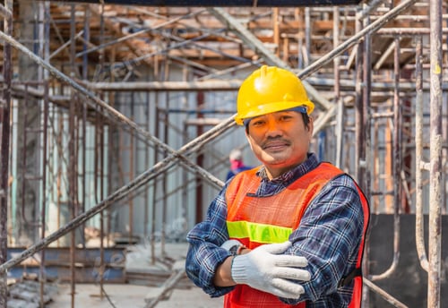 Preview: Worker Checking And Planning Project At Construction Site, Smiling Man With Arms Crossed Over