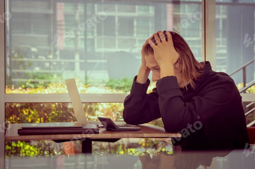 Preview: Frustrated Man Looking At Laptop Holding His Hands To His Head, Tired And Worried Business Man At