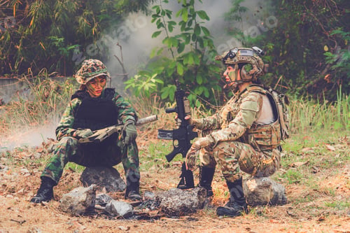 Preview: Woman Soldier.Army Girl With Rifle Sitting In The Forest At Battlefield Area.