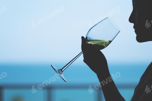 Preview: Silhouette Image Of A Woman Holding A Wine Glass To Drink With Blurred Sea Background