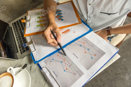 Preview: Man Hand Holding Pen And Checking Financial Number On Sales Document