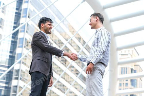 Preview: Two Business Man Meeting Partnership And Shaking Hands For Deal Success At Site Outdoors.