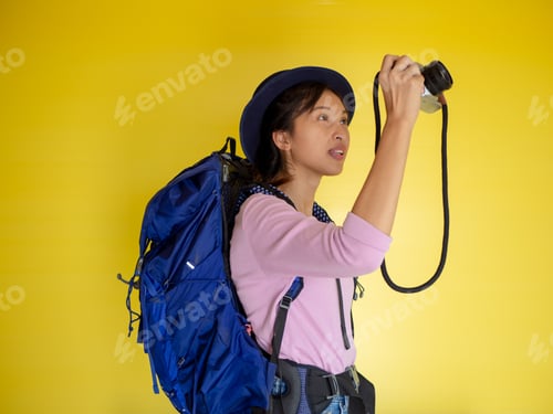Preview: Searching For Inspiring Places. Smiling Adventure Tourist Woman With Backpack And Film Camera