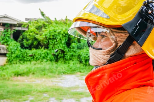 Preview: Close Up Portrait Of Fireman Staring At Danger In Front Of Fire