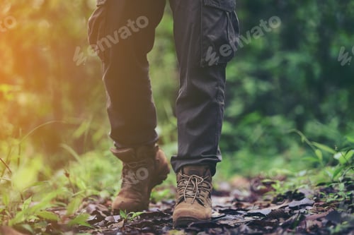 Preview: Foot Of Young Man Traveler Relaxing Outdoor With Rocky Mountains On Background Summer Vacations And