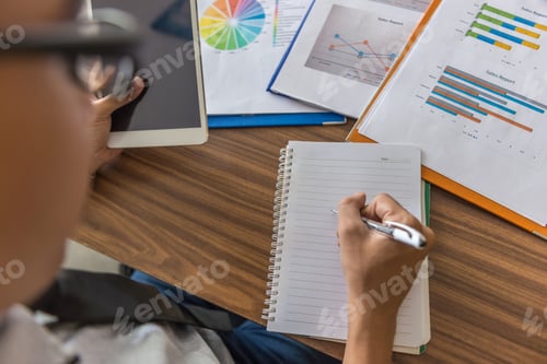 Preview: Young Man Writing Notes In The Office