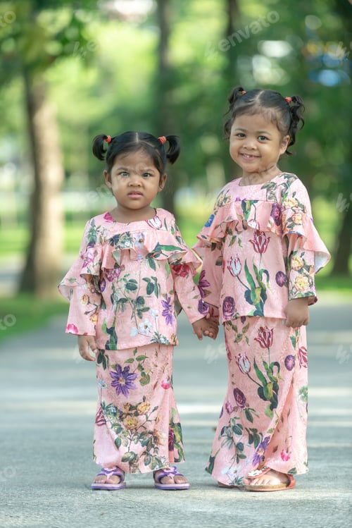 Preview: Malay Muslim Little Girls In Their Beautiful Eid Dress. Outdoor Portrait