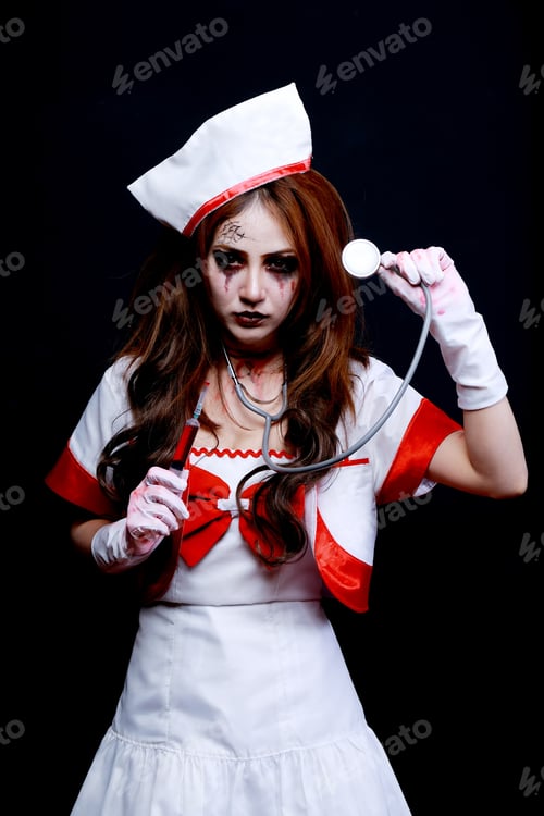 Preview: Crazed Woman Zombie Nurse Or Doctor Covered In Blood In Halloween Concept. Dark Lighting. Color Was