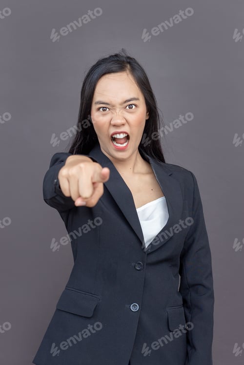 Preview: Mad Asian Lady With Business Uniform Suite Point Action Or Command In Formal Dress On Isolated