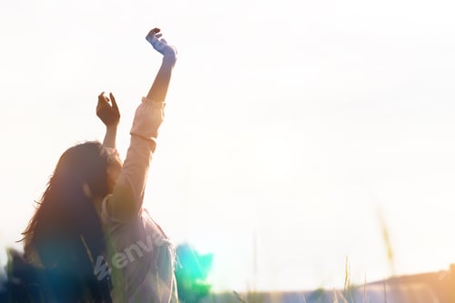 Preview: Silhouette Of Young Woman Standing At Relax Pose Or Freedom Pose Or Chill Pose On The Meadow During