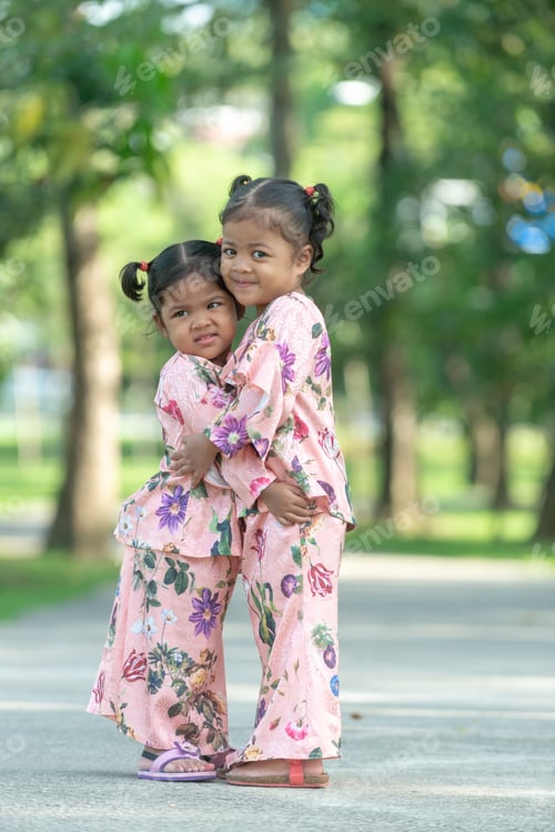 Preview: Malay Muslim Little Girls In Their Beautiful Eid Dress. Outdoor Portrait