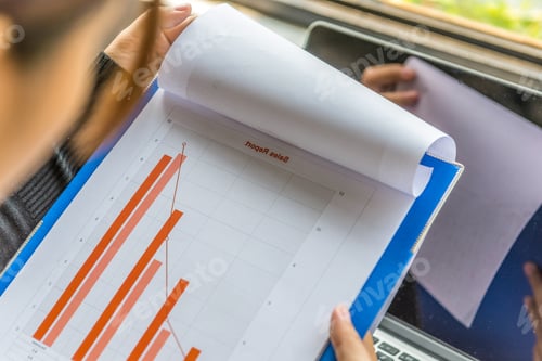 Preview: Woman Hand Holding Sales Statistic Diagram Document