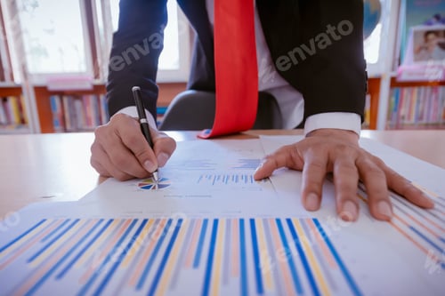 Preview: Hands Of Businessman Working On Laptop Computer With Data Charts