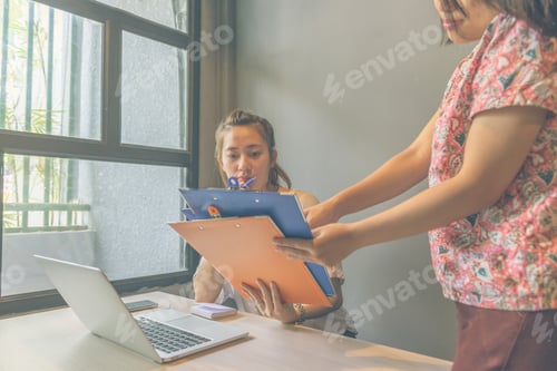 Preview: Woman Reading Report Document Submit By Her Office Staff