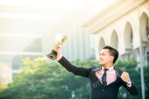 Preview: Businessman Wins A Trophy. Top Salesperson Concept