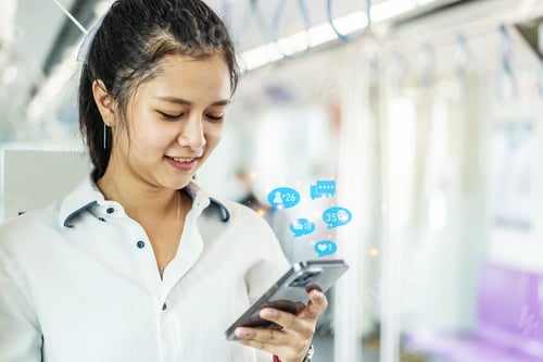 Preview: Young Asian Woman Passenger Using A Social Media Marketing Concept On Mobile Phone With