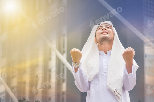 Preview: Success And Happiness Concept, Portrait Of Smiling Arab Middle Eastern Businessman In Sunset