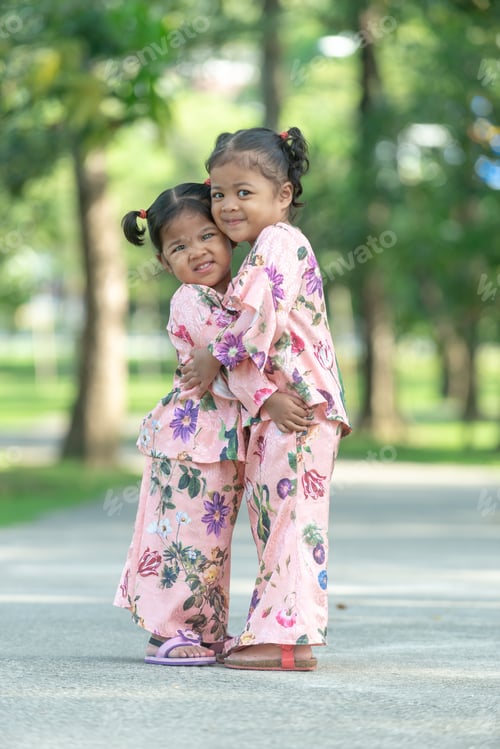 Preview: Malay Muslim Little Girls In Their Beautiful Eid Dress. Outdoor Portrait