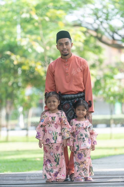 Preview: Father And Daughters - Muslim Malaysian Man And Kids Dressed Up In Eid Dress. Outdoor Portrait