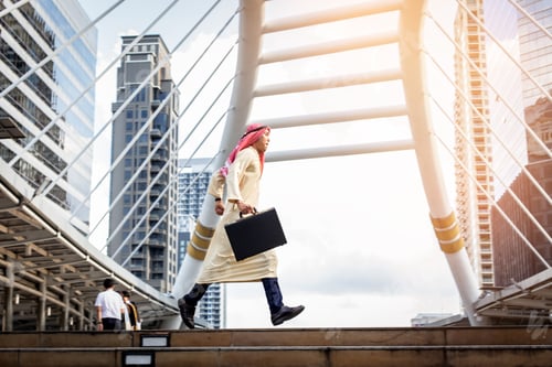 Preview: Young Muslim Business Man Holding Bag And Running Rapidly To Airport. In Rush Hour At Stairway In