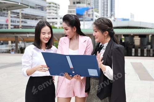 Preview: Smart And Young Beautiful 3 Asian Business Working Woman Group Standing And Holding Files Folder